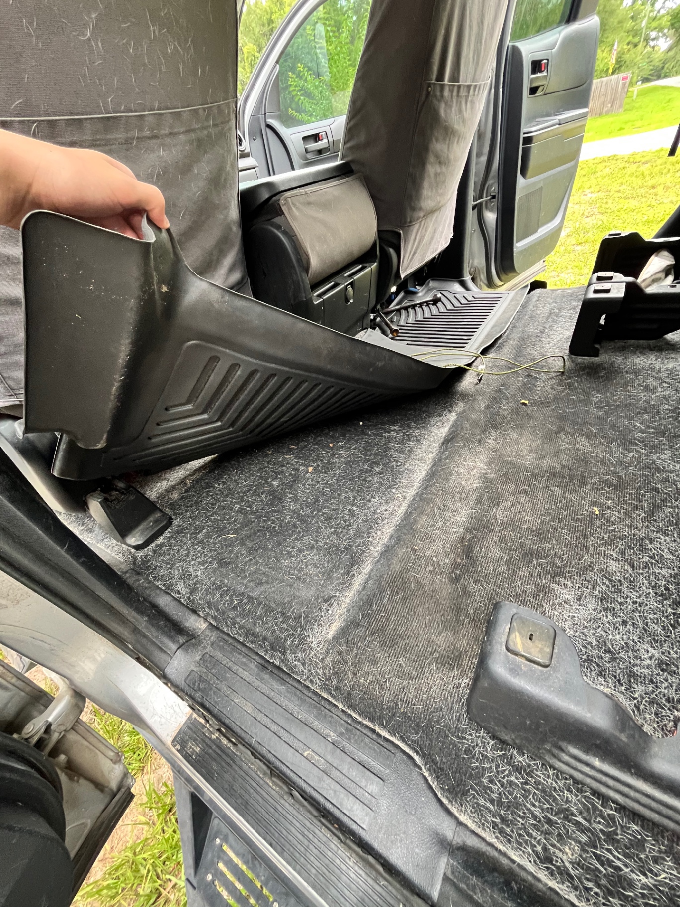 Truck rear floor carpet full of pet hair and dirt before deep interior detail in Inverness FL